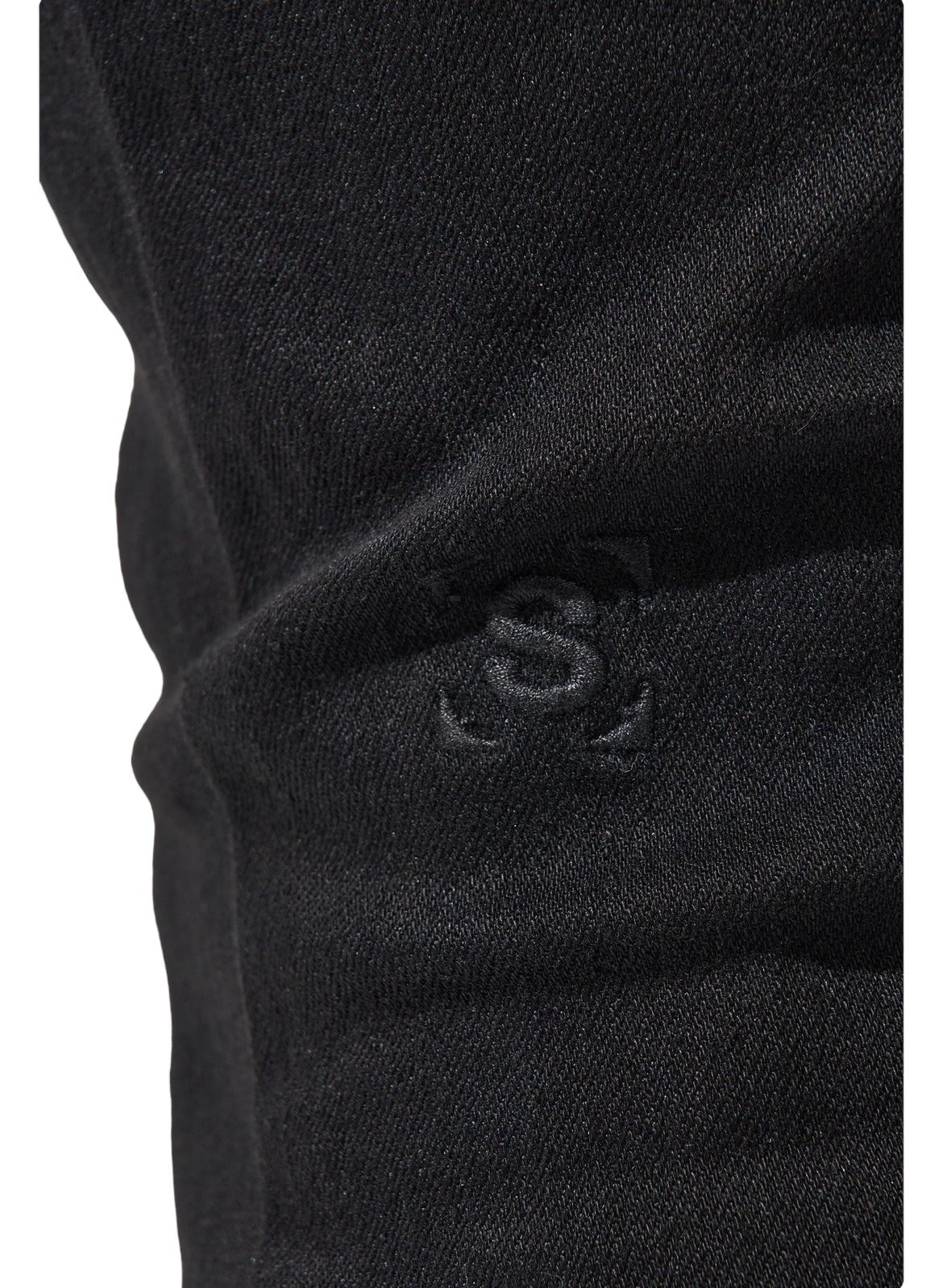 Close-up view of premium fabric with an embroidered logo consisting of the letters "S" and "L" entwined, reminiscent of the stylish detail found on SERENEDE VANTA 11 JEANS BLACK by SERENEDE.