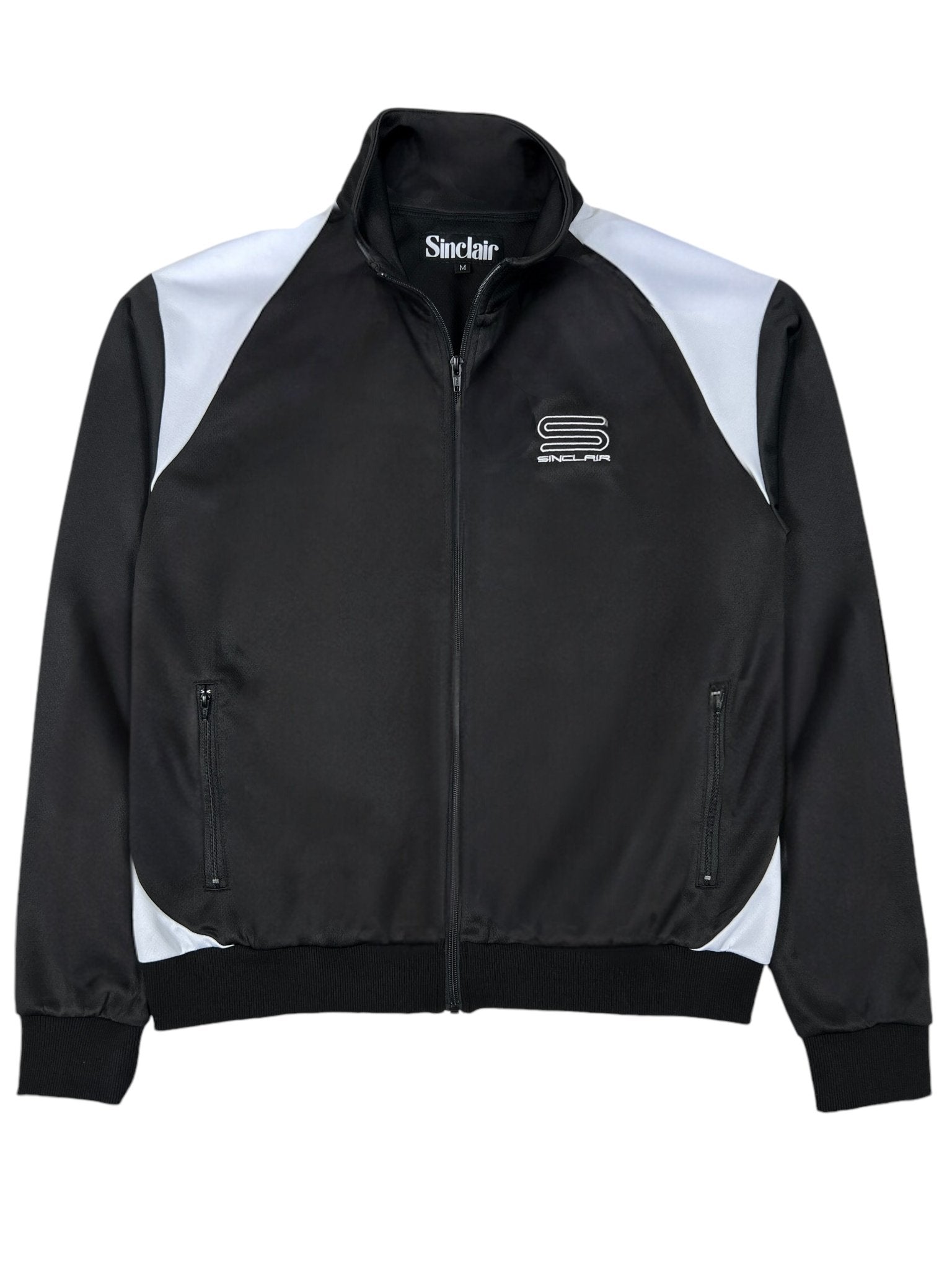 The Sinclair SMT190 Tech Logo Track Jacket in black features a front zipper, embroidered SINCLAIR logo on the chest, and two side pockets.