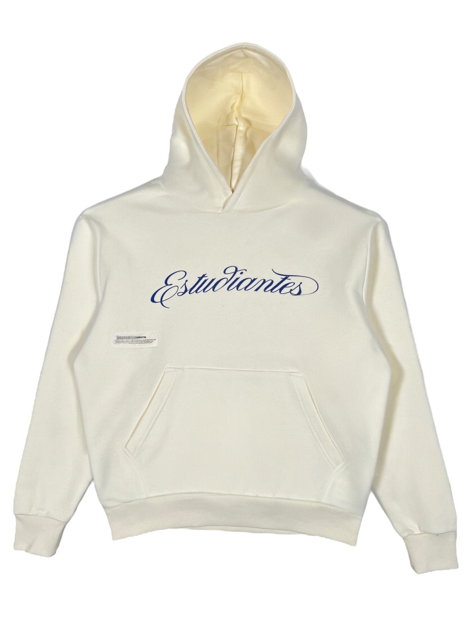 The Students Estudiantes Pullover Hood Nude by STUDENTS is a 100% cotton hoodie featuring "Estudiantes" in cursive blue on the front, complete with a convenient front pocket and cozy drawstring hood for ultimate comfort.