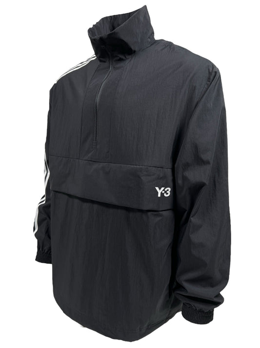A black half-zip oversized jacket with a high collar and ADIDAS x Y-3 branding on the front. The design features white stripes on the shoulders and elastic cuffs on the sleeves. This product is called Y-3 JD9796 3S NYL HZ BLACK.