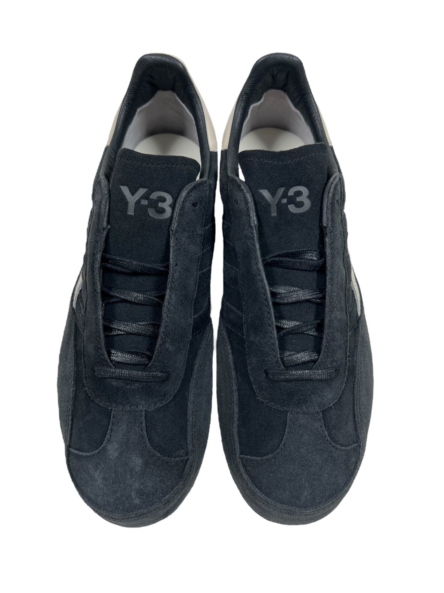 Viewed from above, a pair of black Y-3 JH8925 Gazelle Black/Alumin sneakers by ADIDAS x Y-3 showcases a sleek suede finish and matching black laces.