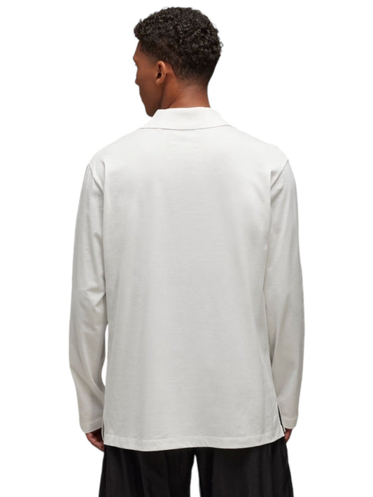 Back view of a person wearing the Y-3 JM3233 U GFX Logo long-sleeve tee in Cwhite from ADIDAS x Y-3, paired with black pants.