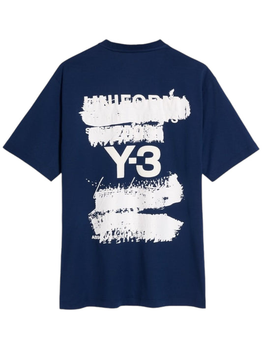 ADIDAS x Y-3 JM7816 U GFX SS Tee in dark blue, featuring abstract white paint streaks and bold "Y-3" text on the back, crafted from soft cotton fabric.