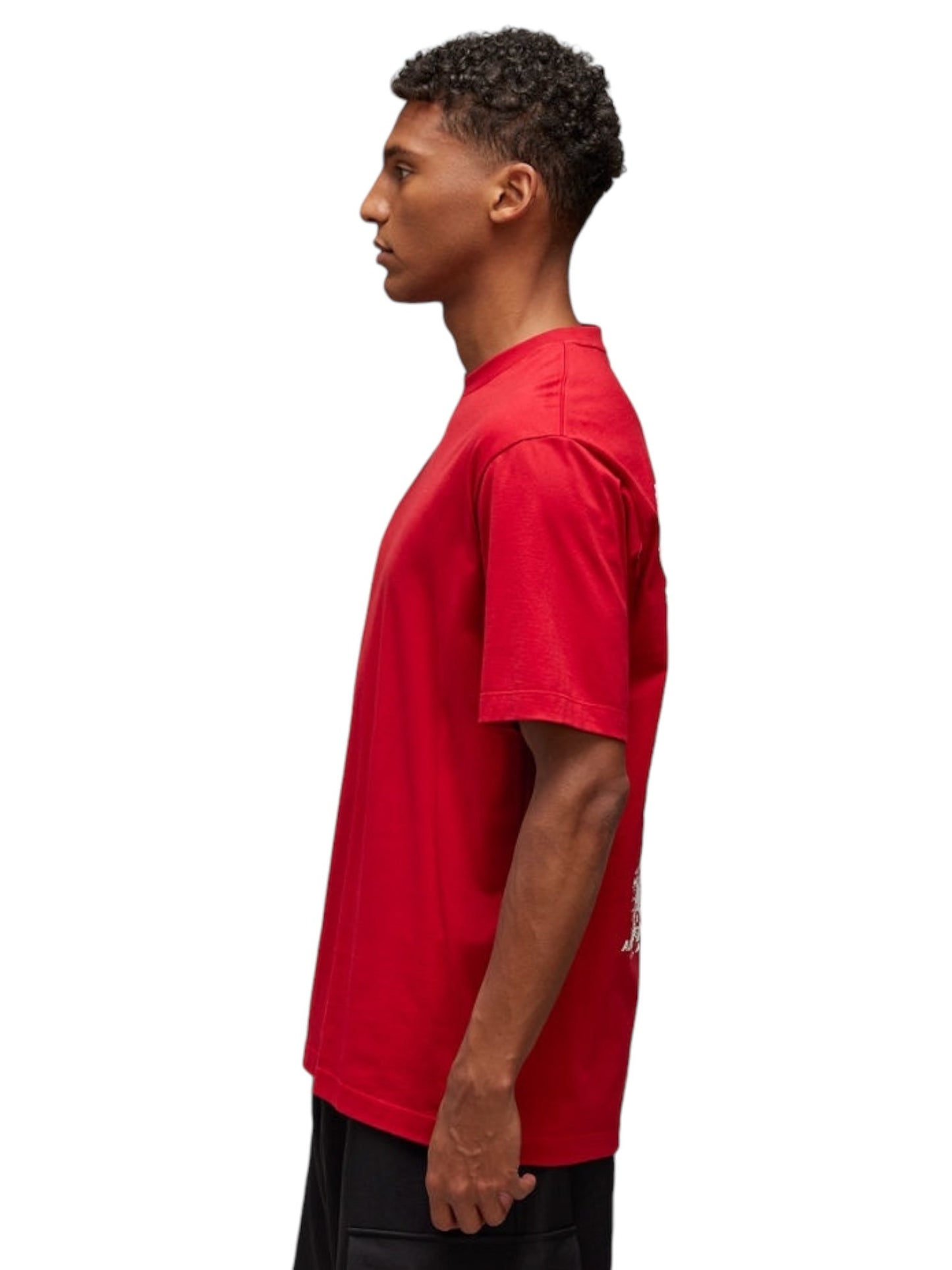 A man wearing the ADIDAS x Y-3 Y-3 JN3751 U GFX SS Tee in Powred, made from soft cotton fabric, along with black pants is shown in profile against a white background.