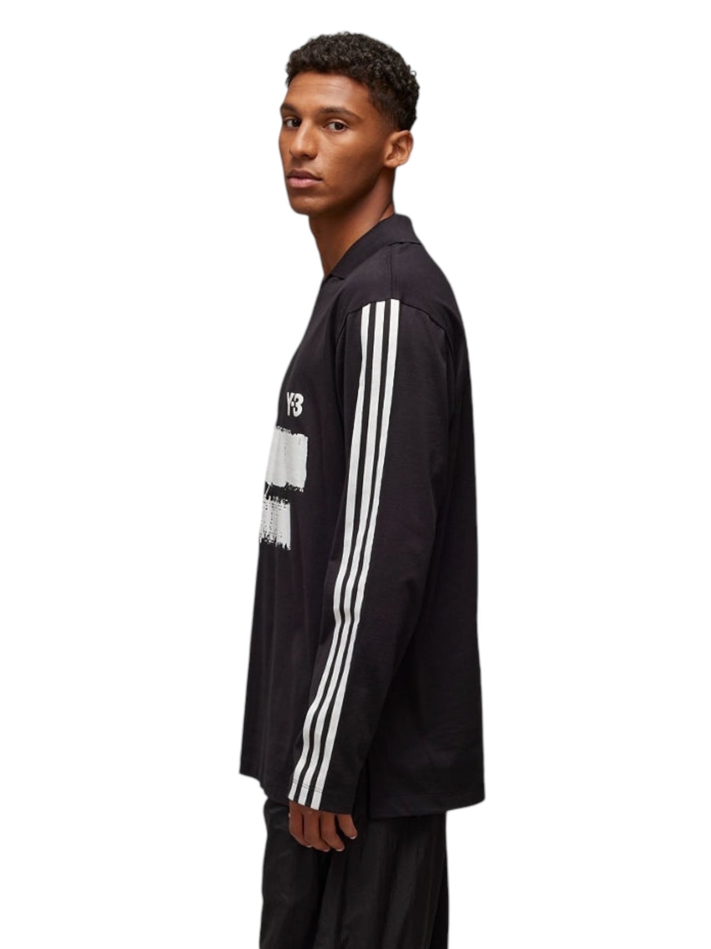 A person wearing the ADIDAS x Y-3 JN4876 U GFX Logo Long Sleeve Tee in black is standing against a plain white background.