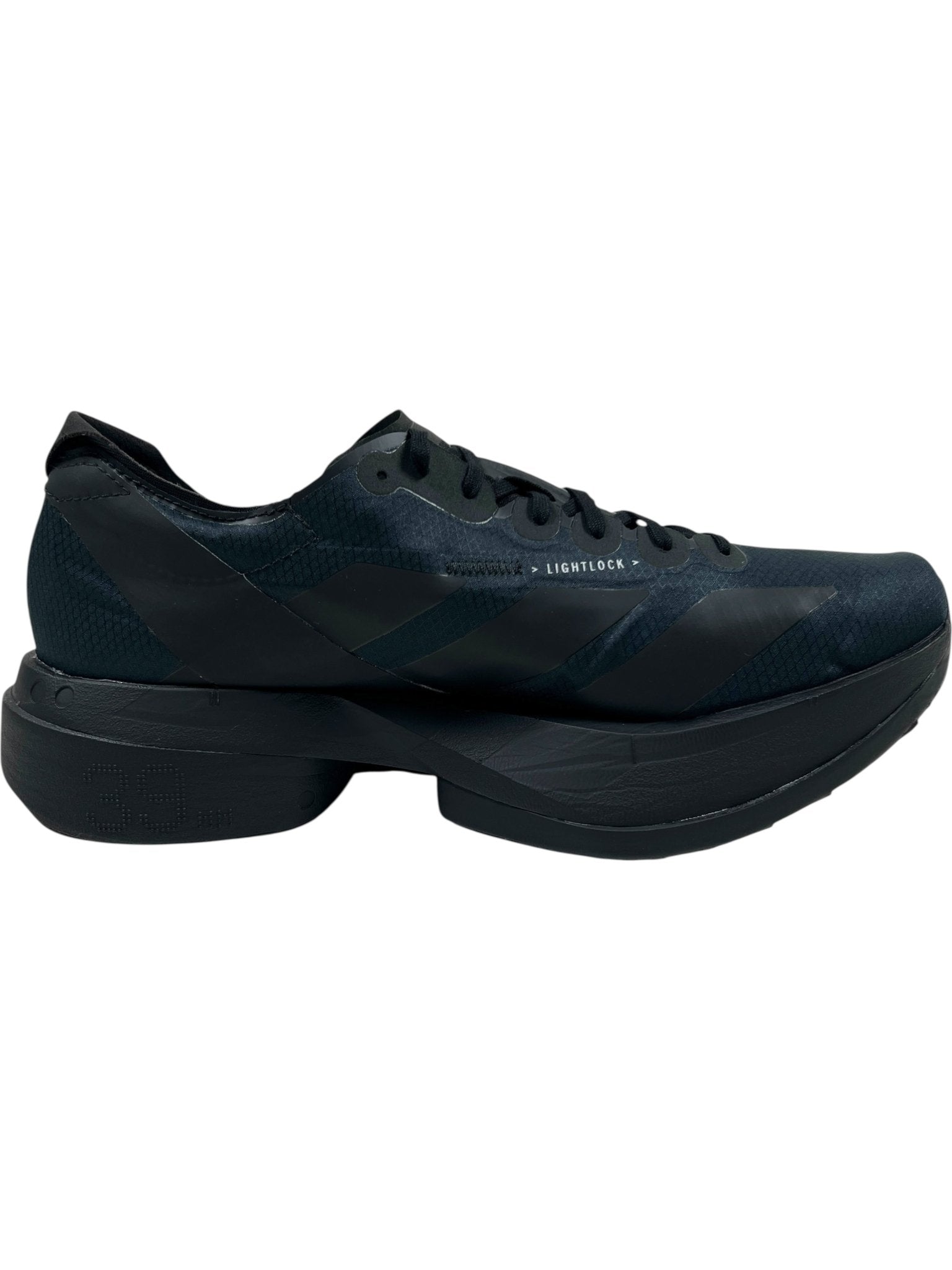 The ADIDAS x Y-3 Y-3 JR6655 ADIOS PRO 4 M in Black/Black-CWhite is a black athletic running shoe featuring a thick segmented sole with Lightstrike Pro cushioning and a lightweight, low-profile upper.