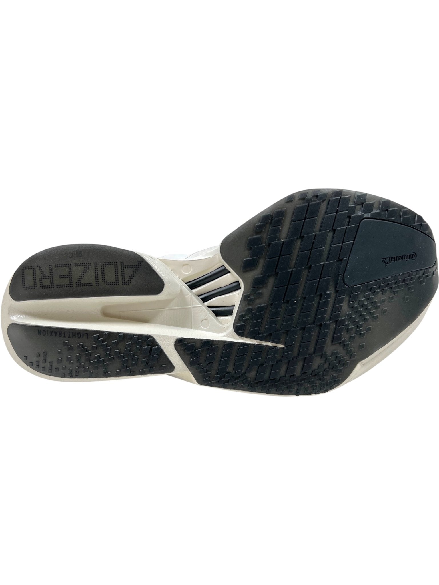 Bottom view of the ADIDAS x Y-3 JR6656 Y-3 Adios Pro 4 M Orbgry/Black running shoes, showing a black and white rubber outsole with grid-like tread, "ADIZERO" on the heel, and advanced Lightstrike Pro cushioning.