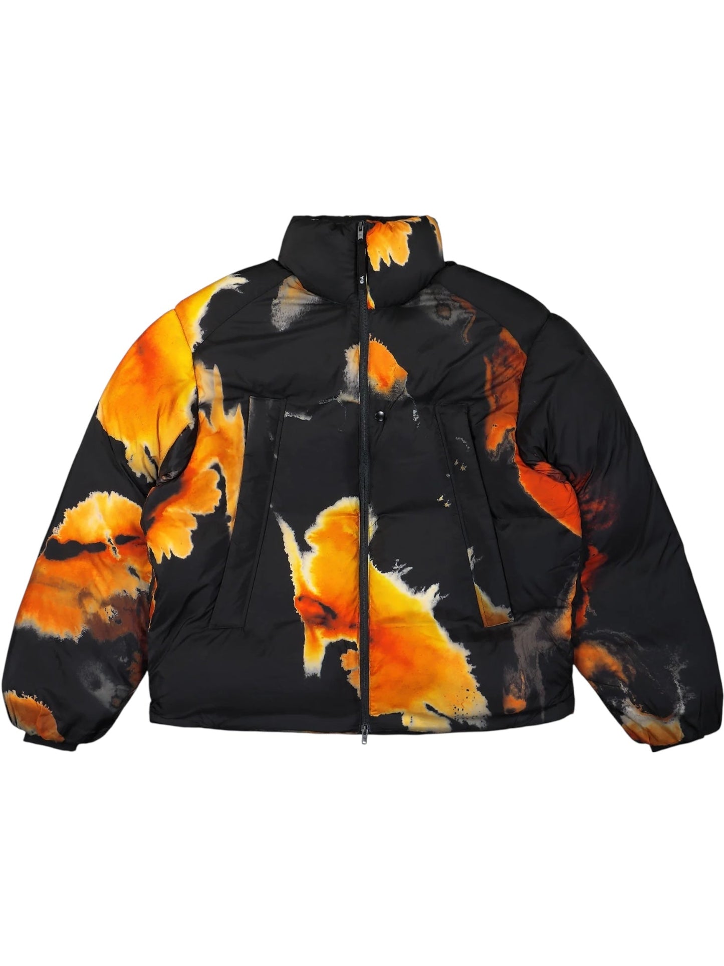 The ADIDAS x Y-3 KA2364 M AOP Puff JKT Multco/Black is a black polyamide puffer jacket with an abstract orange-yellow flame pattern, shown flat with a front zipper and two vertical front pockets.