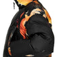 A person in the ADIDAS x Y-3 KA2364 M AOP Puff JKT Multco/Black, a black polyamide puffer jacket with an orange and yellow abstract pattern, is photographed from the side.