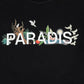 The image showcases the 3.Paradis SS T-Shirt Paradis Blk, a trendy graphic tee from 3.PARADIS featuring "PARADIS" printed in white on a black background. It's adorned with birds, leaves, and other nature elements and is made from 100% cotton for exceptional comfort.
