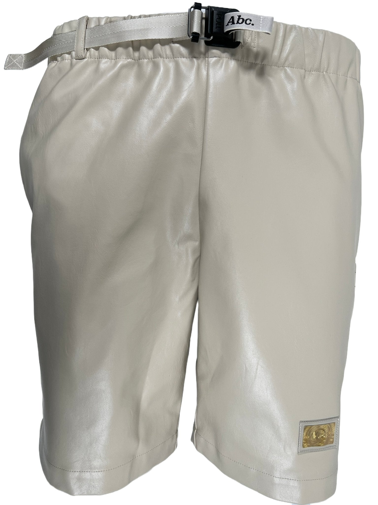 The Advisory Board Crystals Faux Leather Work Shorts in Feldspar Ecru by ADVISORY BOARD CRYSTALS are crafted from leather and feature an adjustable belt with a discreet logo patch near the hem.