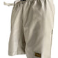 The Advisory Board Crystals Feldspar Ecru faux leather work shorts by ADVISORY BOARD CRYSTALS include an adjustable buckle belt and a small logo patch on the left leg.