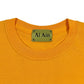 Close-up of the neckline of the Al Ain AMHX S120 Jabalia Ocre Yellow t-shirt, featuring a green AL AIN label.