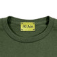 A peacock militaire t-shirt from AL AIN, showcasing an embroidered label with the words "Al Ain.