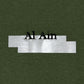On an olive green background, a white band showcases the bold black lettering "Al Ain," representing the Al Ain AMHX S121 Peacock Militaire by brand AL AIN.
