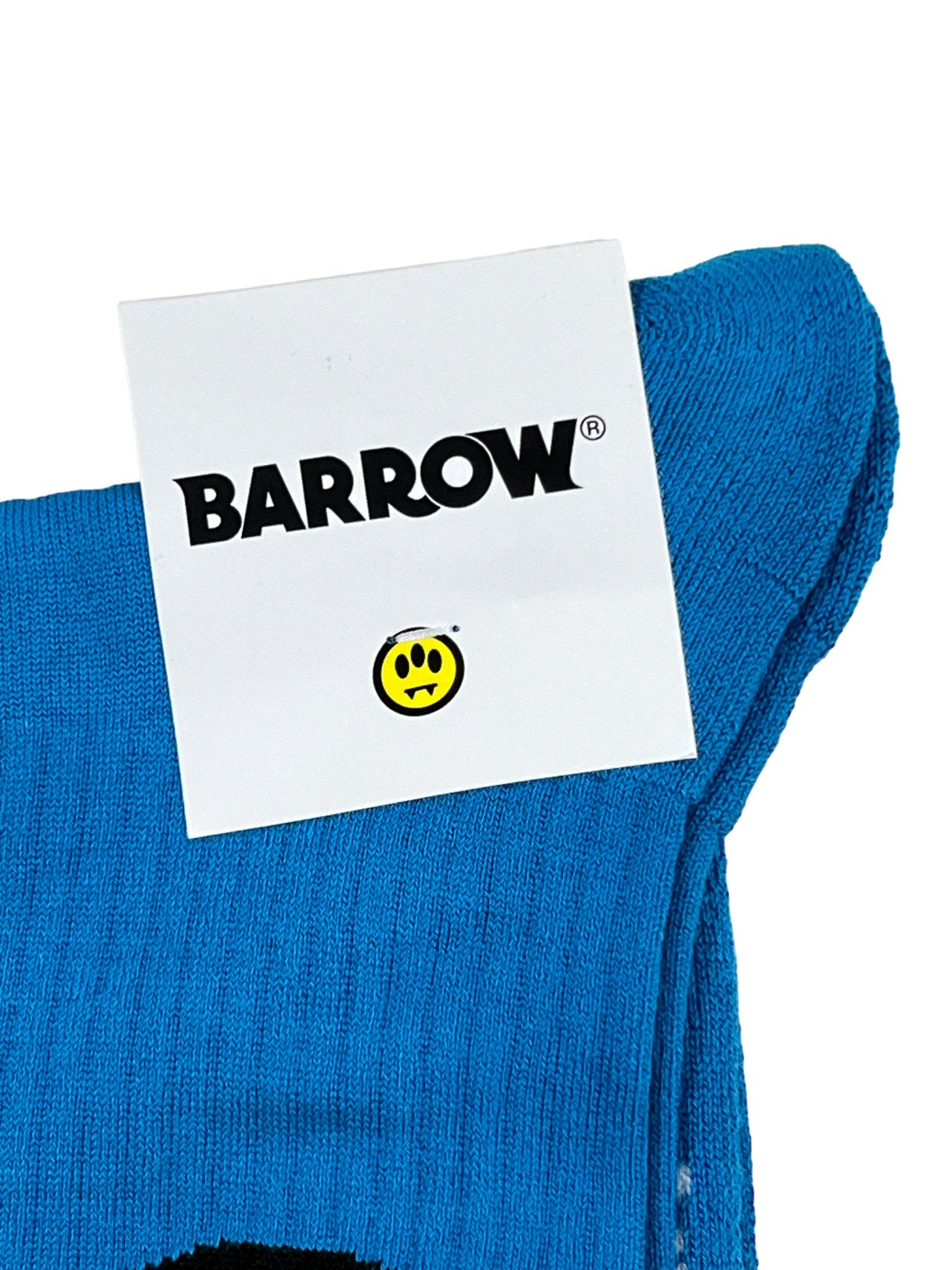 The blue knit Barrow S4BWUASO140 Socks Unisex showcases a "BARROW" card alongside a small yellow smiley face logo, emphasizing the fine Italian craftsmanship of BARROW's signature graphic socks collection.