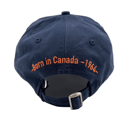 A DSQUARED2 navy blue hat with the words born in Canada embroidered on it.