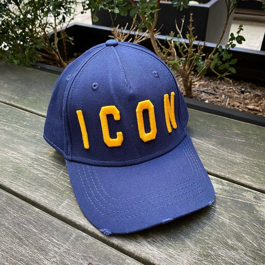A DSQUARED2 navy blue baseball cap with the word ICON on it.