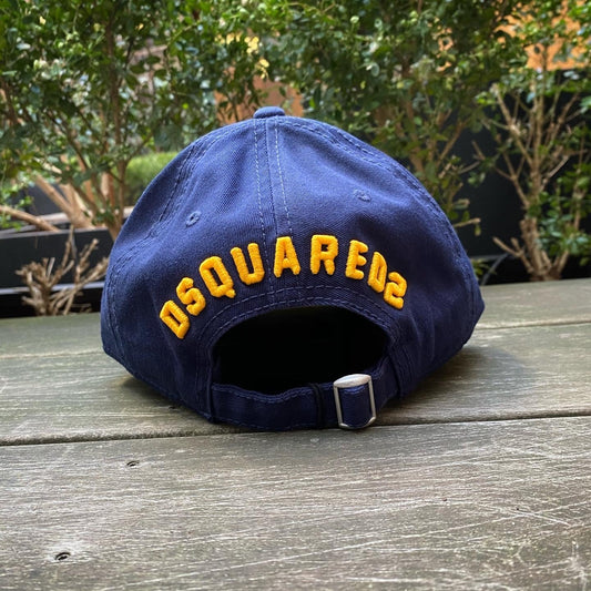 A DSQUARED2 navy blue hat with the word DSQUARED2 on it.