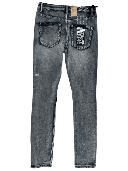 A pair of mens denim KSUBI CHITCH HYPNOTIZE TRASHED jeans with a logo on the back.