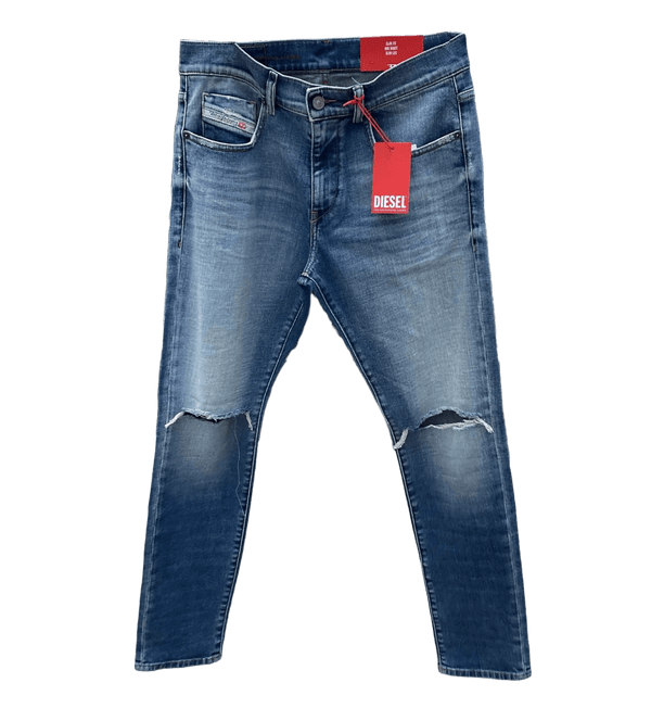A pair of light blue DIESEL D-STRUKT 9C87 DENIM jeans with a tag on them.