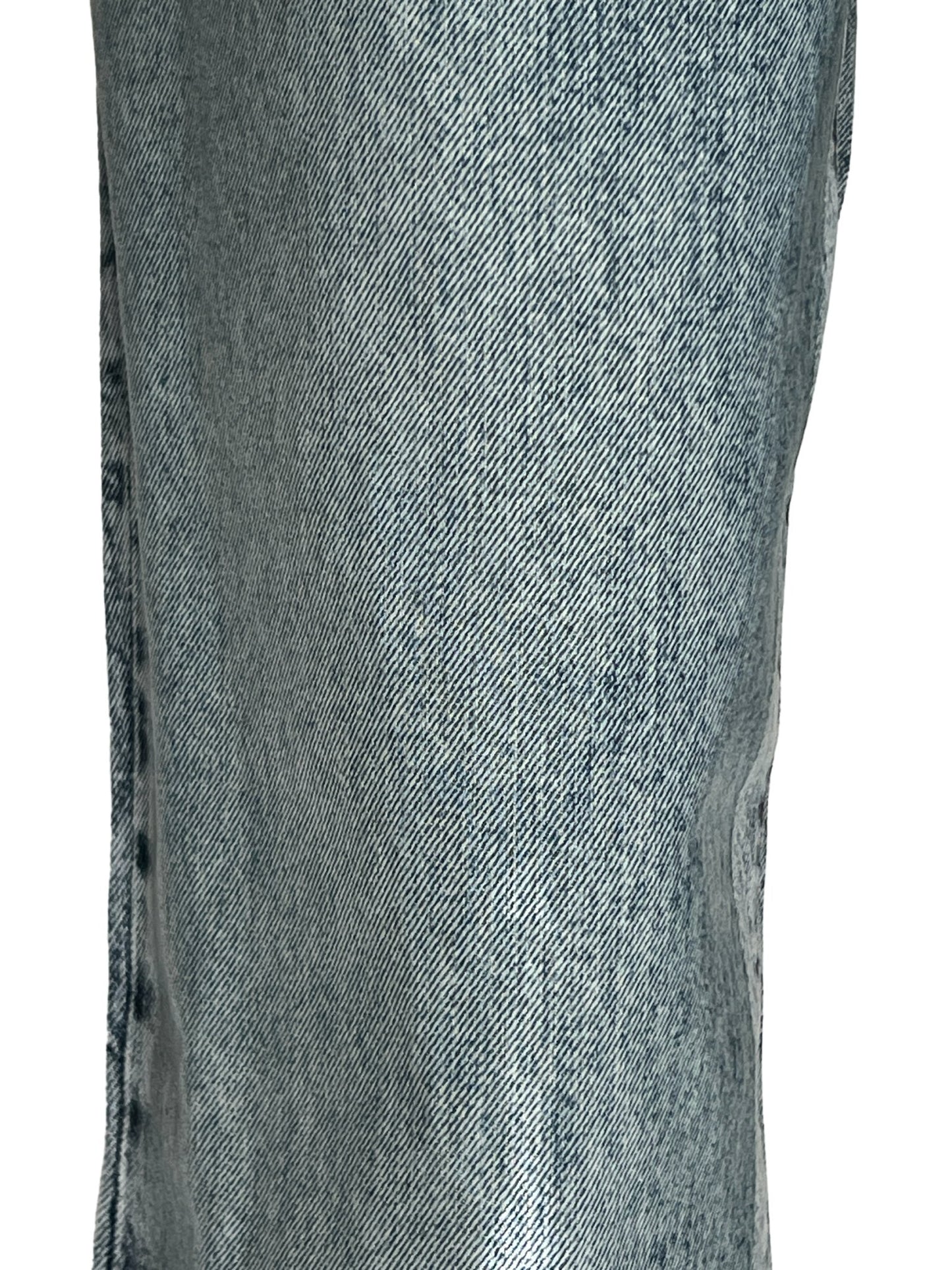 Close-up of Diesel light wash blue denim fabric with visible texture and seam details.
