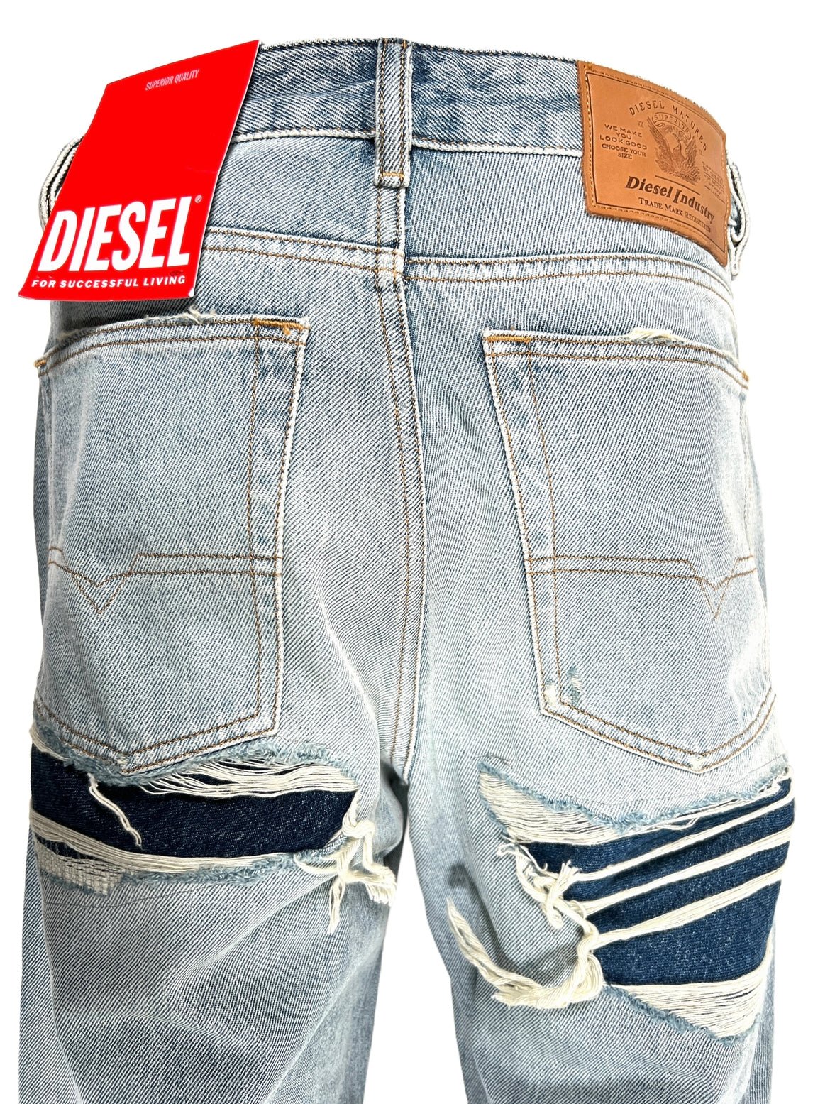 A pair of DIESEL light blue jeans with a tag on the back.