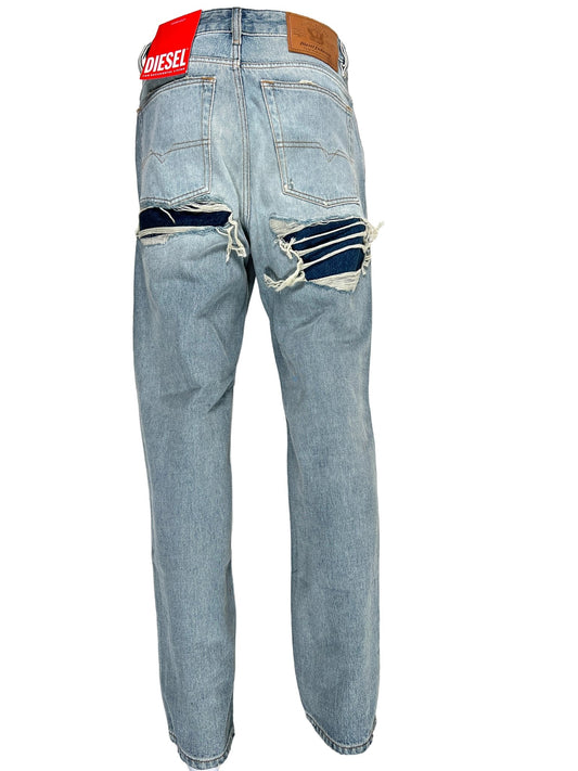 The back view of a light blue, ripped pair of DIESEL 1955 JEANS 9C90 men's jeans.
