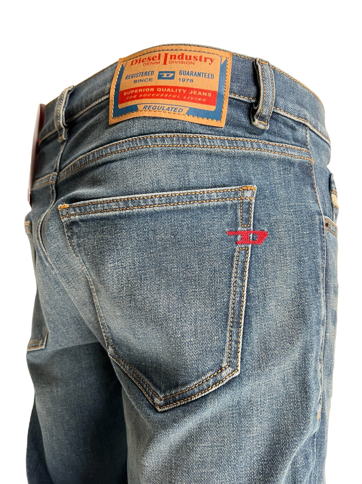 The back pocket of a pair of DIESEL 1979 SLEENKER 9H69 DENIM jeans.