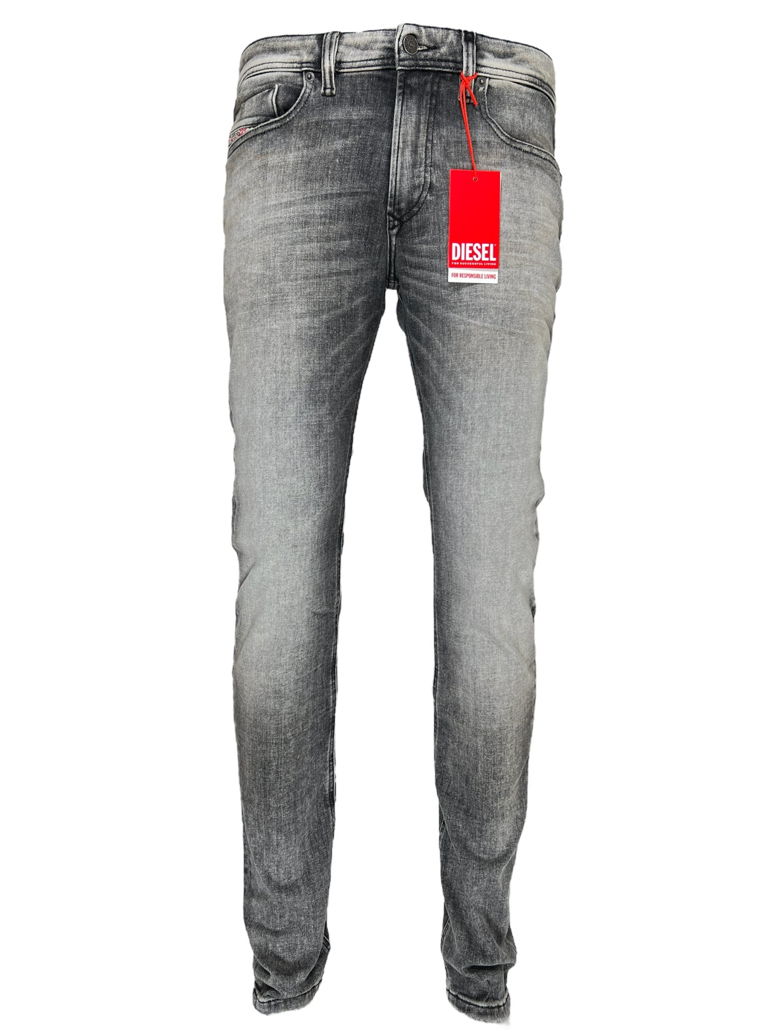 The Diesel 1979 Sleenker 9H74 skinny jeans, made from stretch denim and featuring a red DIESEL tag, are shown on a plain white background.