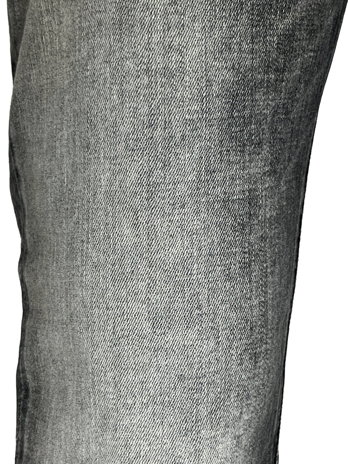 Close-up of a DIESEL 1979 SLEENKER 9H74 stretch denim fabric texture.