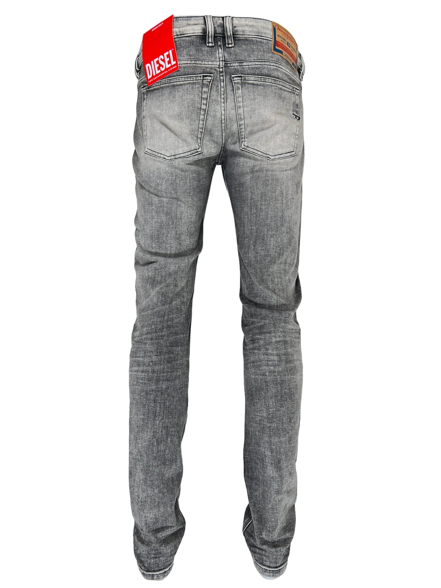 Back view of Diesel 1979 Sleenker 9H74 skinny jeans in gray, made from stretch denim with red tags, featuring pockets and belt loops.