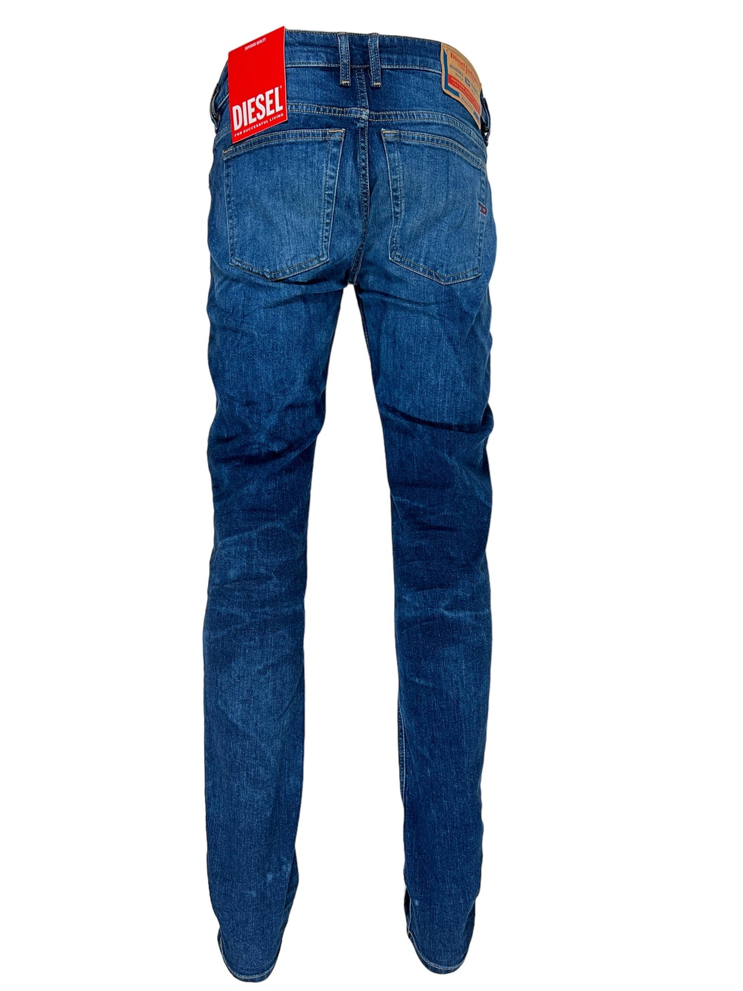 A pair of DIESEL 1979 SLEENKER PFAU DENIM skinny style jeans with a red tag on the back.