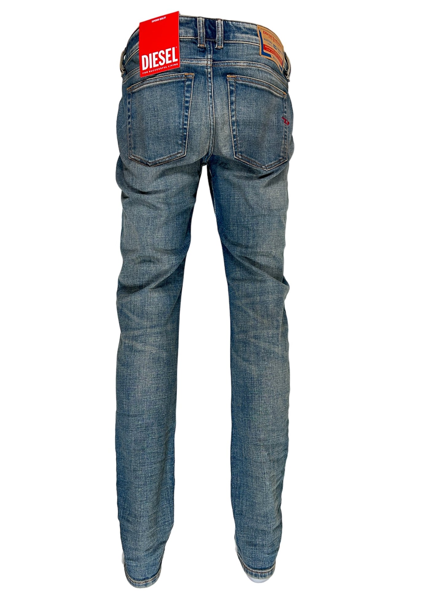 A pair of DIESEL 2019 D-STRUKT 9H49 DENIM slim fit jeans with a red tag on the back.