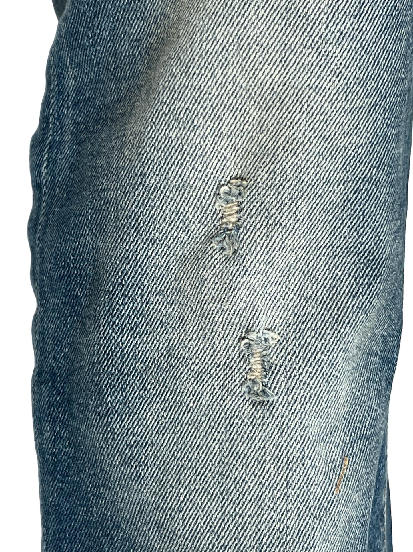 A pair of DIESEL 2019 D-STRUKT 9H55 DENIM with holes in them.
