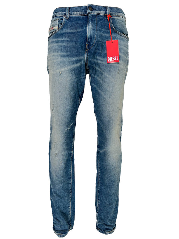 A pair of DIESEL 2019 D-STRUKT 9H55 DENIM slim fit jeans with a tag on them.