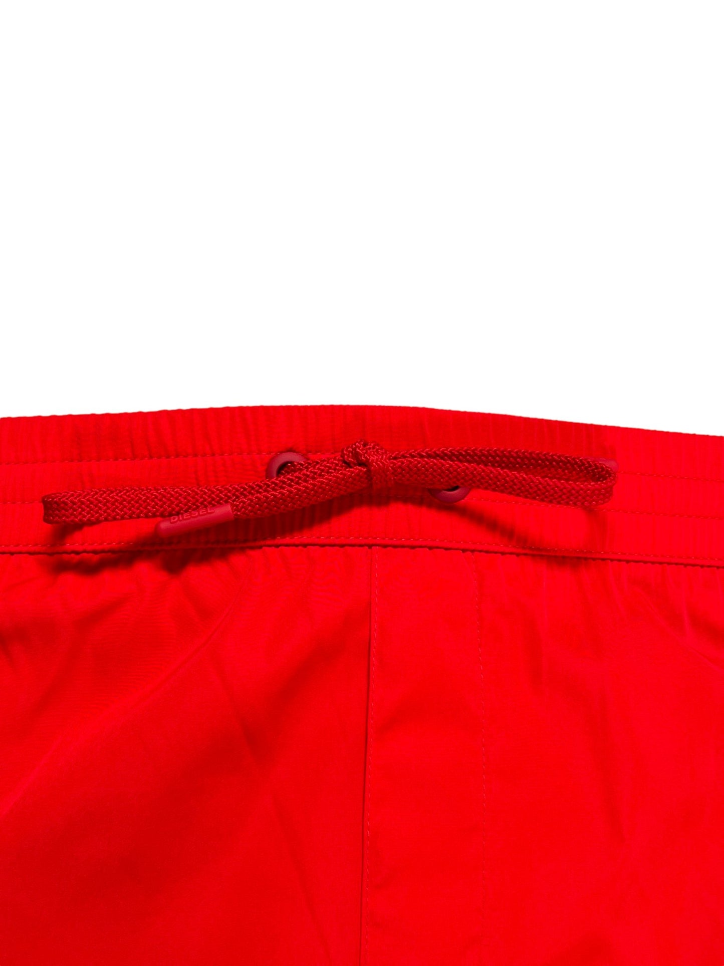 DIESEL men's swimming shorts with a drawstring on a white background.