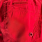 Close-up of a red fabric pocket with visible stitching and a buttonhole on Diesel BMBX-Mario-34 Short Red swimming shorts.