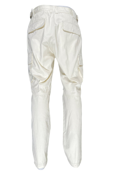 A pair of DIESEL P-ARGYM cargo pants in cream with cargo pockets on a white background.