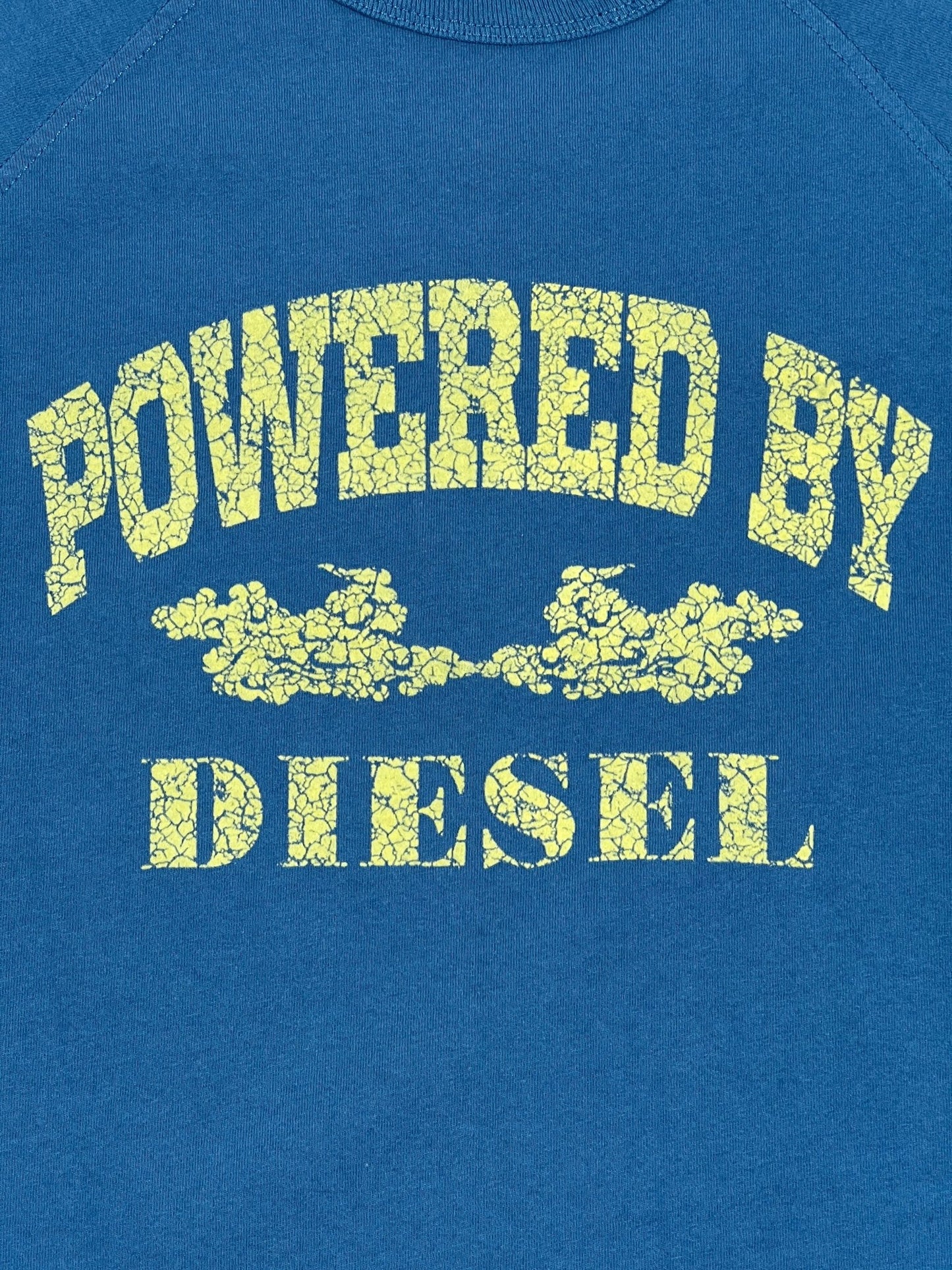 DIESEL T-RUST T-SHIRT TEAL with the text "powered by diesel" printed in yellow, with a distressed effect.