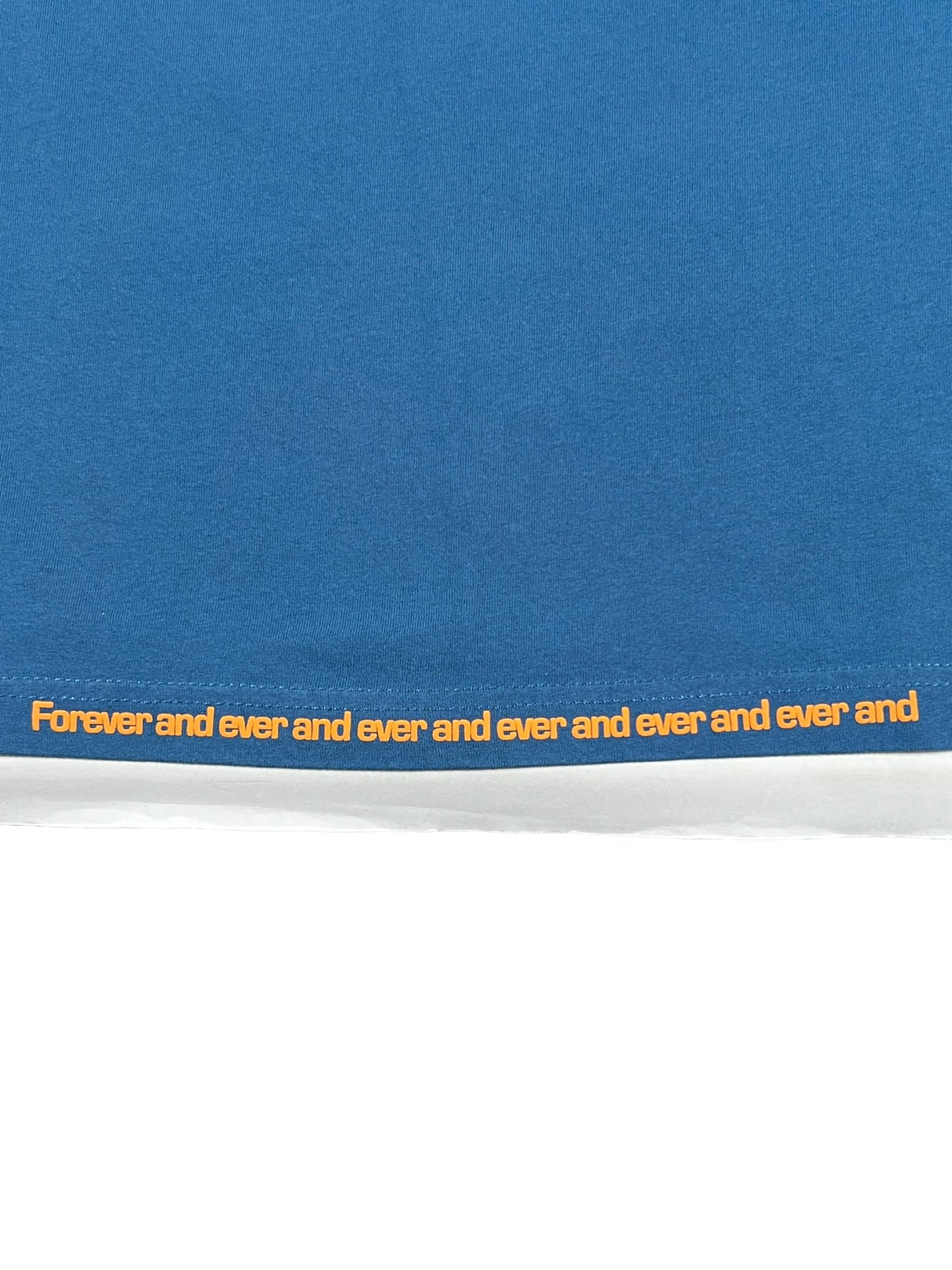 DIESEL T-RUST T-SHIRT TEAL 100% Cotton textile with the phrase "forever and ever and ever and ever and ever and ever" repeated in yellow lettering along the edge.