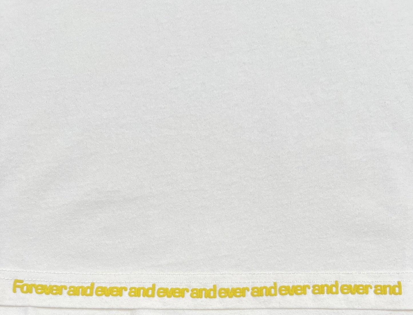 A repetitive text pattern saying "forever and ever and ever and ever and ever and" printed on a 100% cotton white fabric background of a DIESEL T-RUST T-SHIRT.