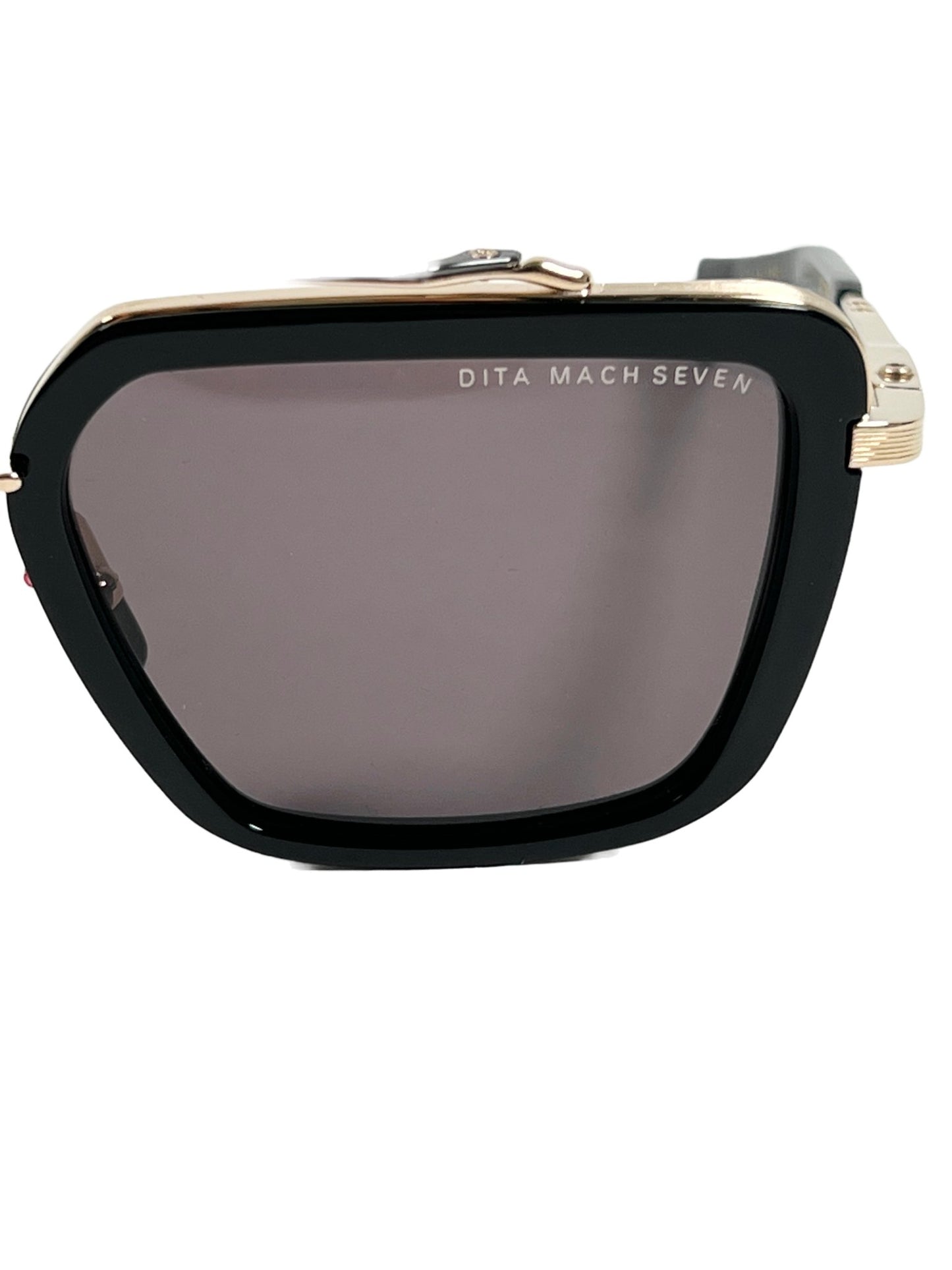 A pair of DITA Mach-Seven DTS135-56-01 sunglasses with a black frame and black/white gold accents.