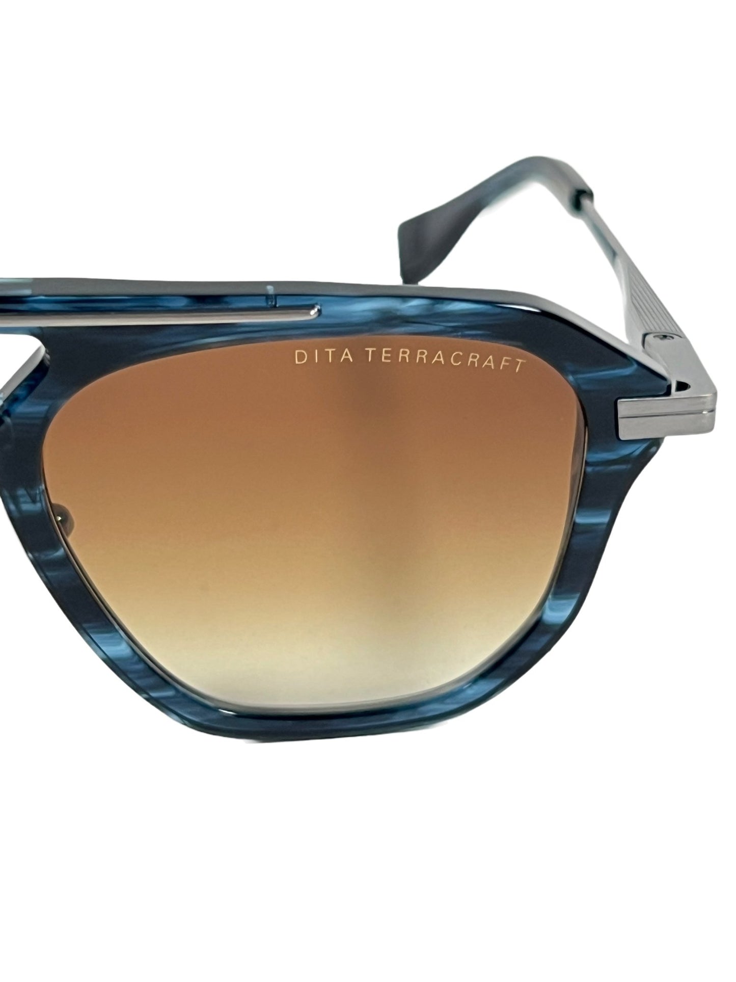 A pair of DITA sunglasses with a blue-yellow frame and brown lenses.