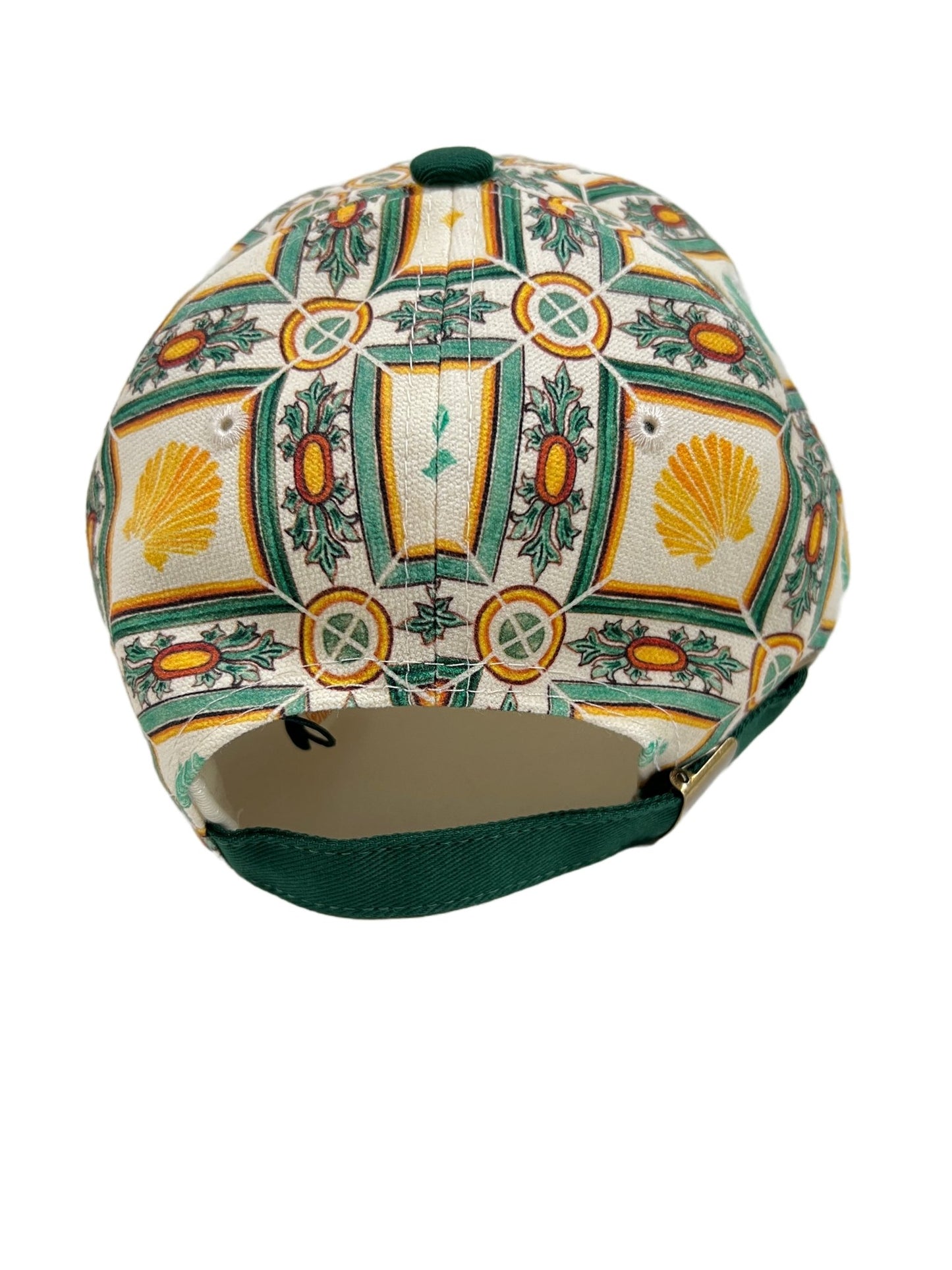A green and white DROLE DE MONSIEUR HAT CP117-CO041 LA CASQUETTE SHELL GREEN with a print on it.