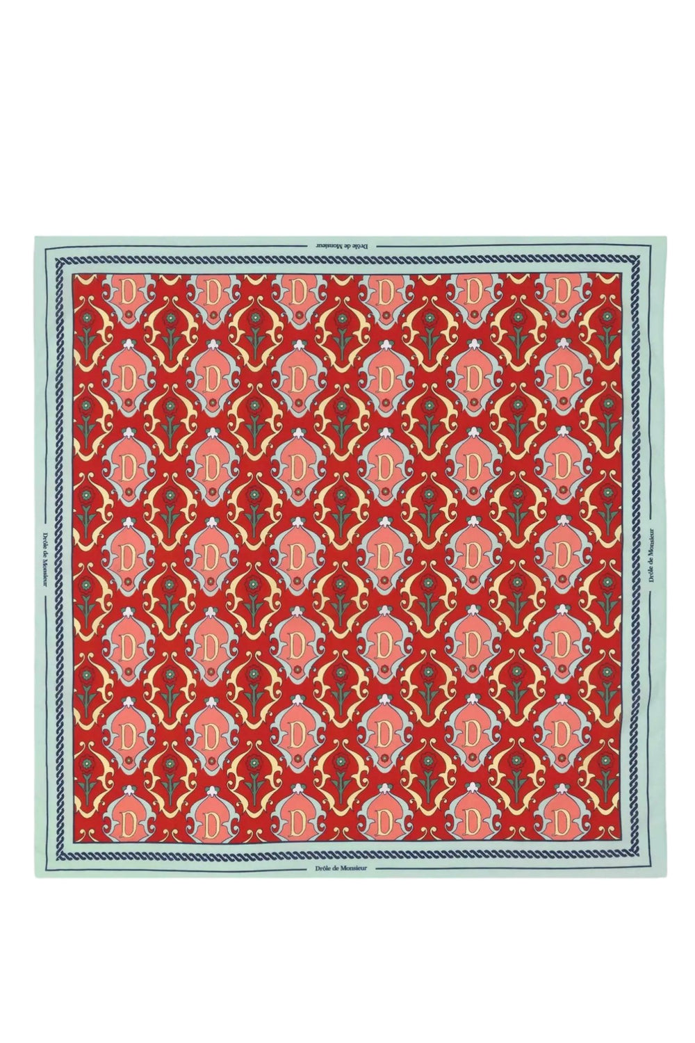 Red DROLE DE MONSIEUR ornamental rug with repeating patterns and a cotton scarf decorative border.