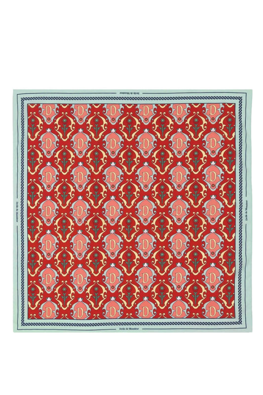 Red DROLE DE MONSIEUR ornamental rug with repeating patterns and a cotton scarf decorative border.