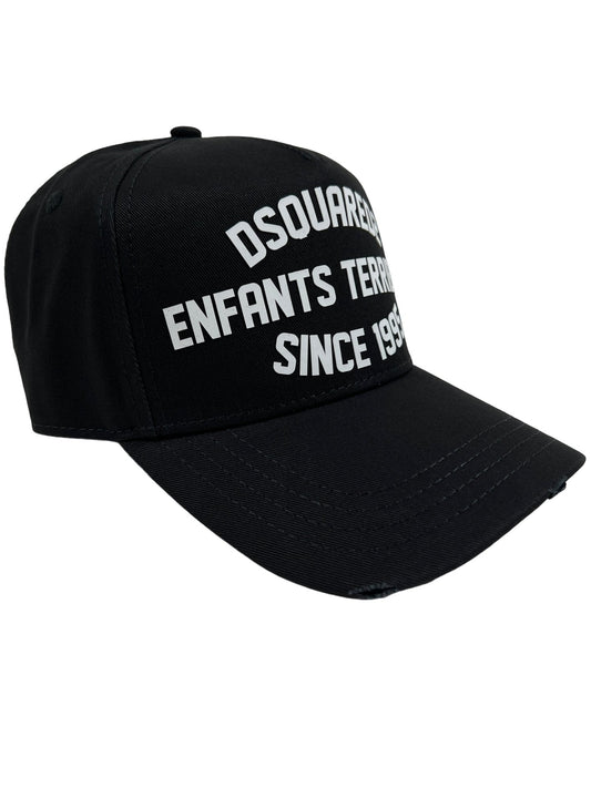 A black DSQUARED HAT BCM0766 BASEBALL CAP GABARDINE-NERO that says Dsquared2 enfants terrestres since 1999.