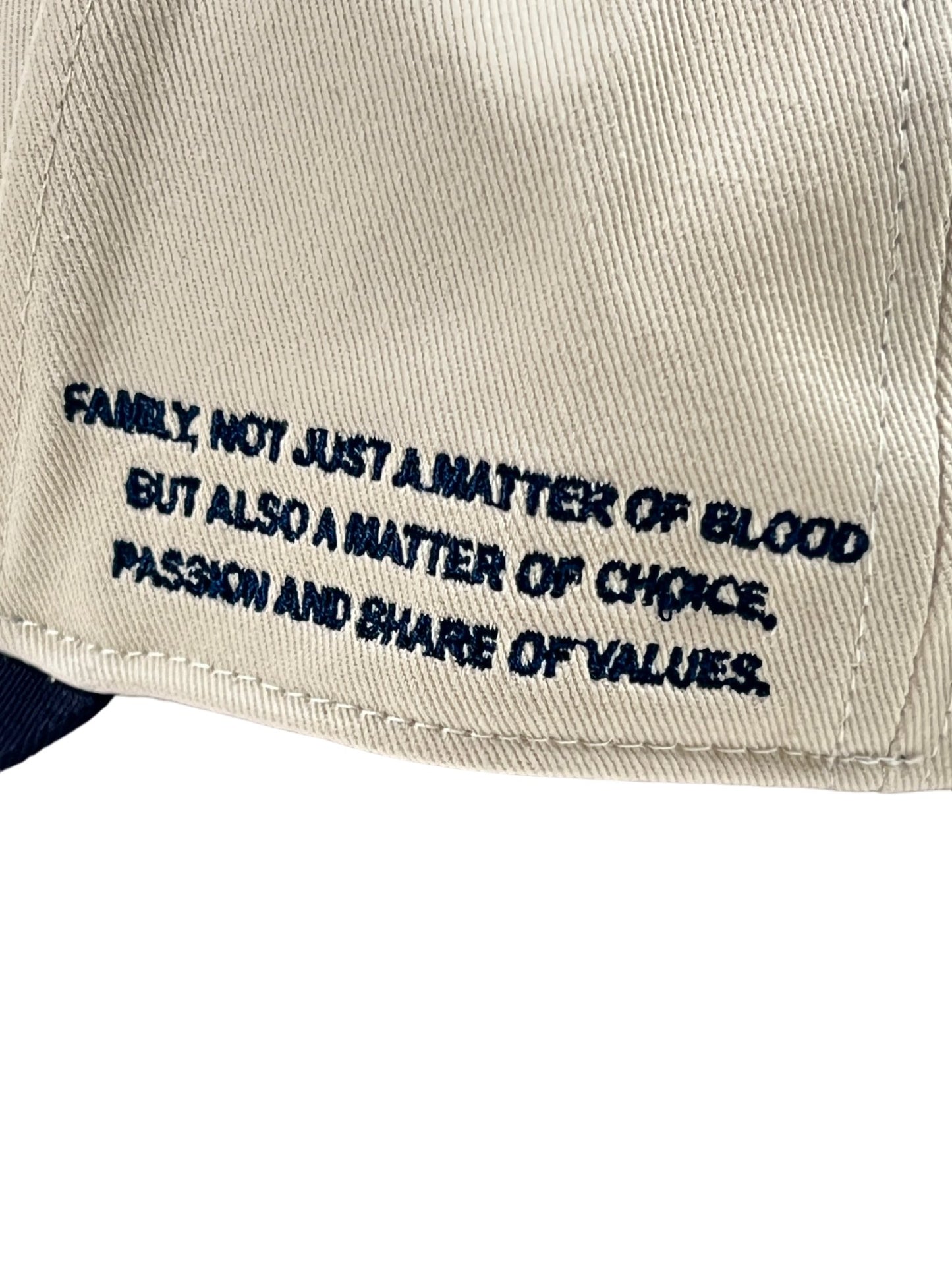 An FAMILY FIRST HF2402 hat with the words, "Failure is not a matter of blood, it's also a matter of choice.