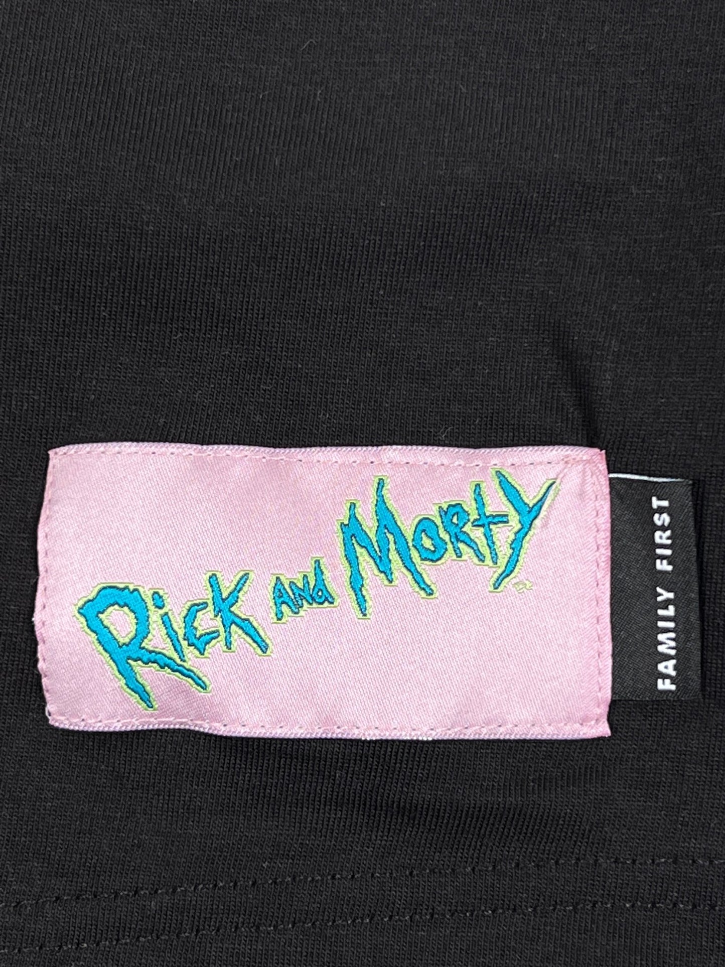 A black graphic FAMILY FIRST t-shirt with the words rick and morty on it, made from 100% cotton.